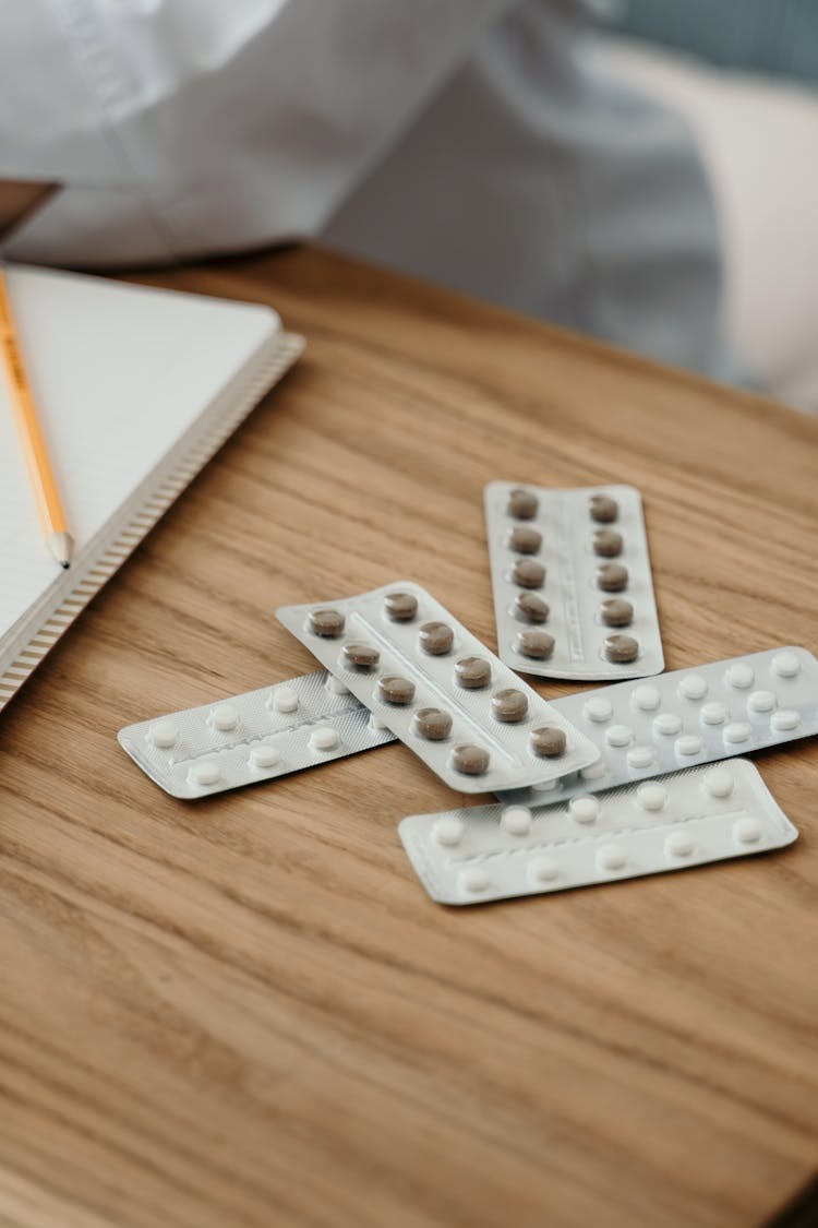 Medicines On A Wooden Surface