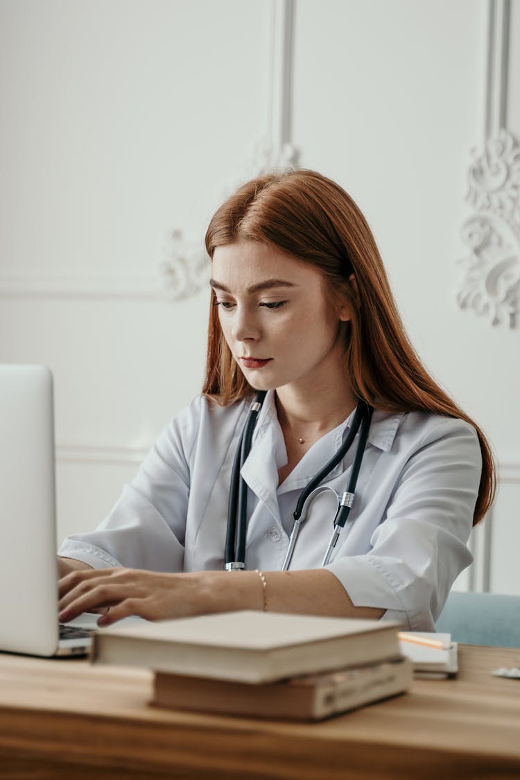 A Doctor Working With A Laptop