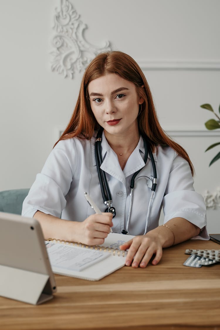 Female Doctor Holding A Pen 