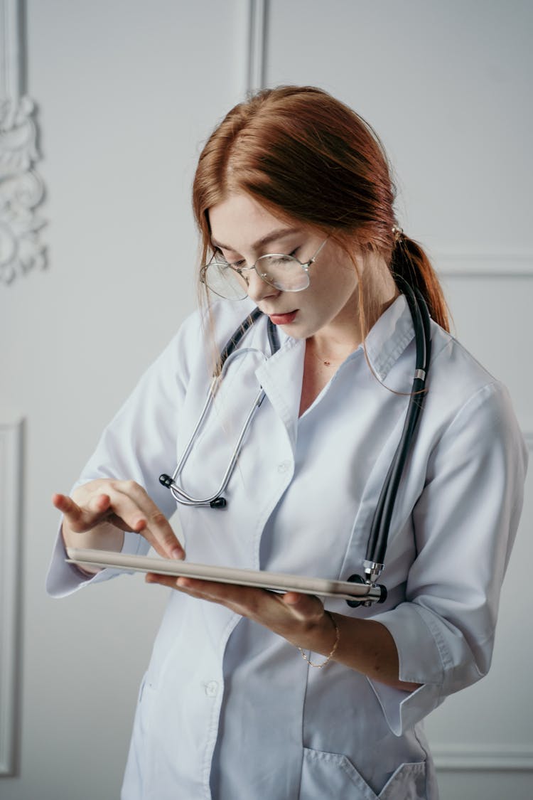 Doctor Holding A Tablet 