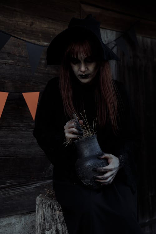 Witch Holding a Clay Jar
