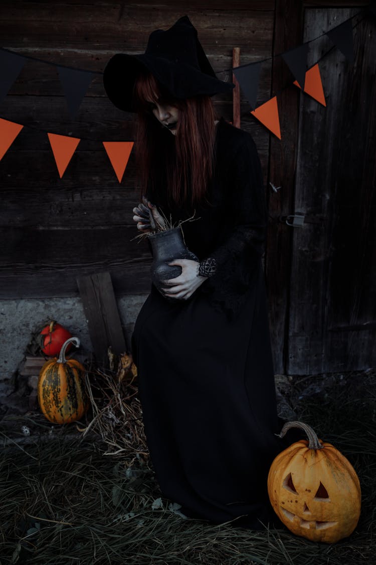 Witch Holding A Clay Jar