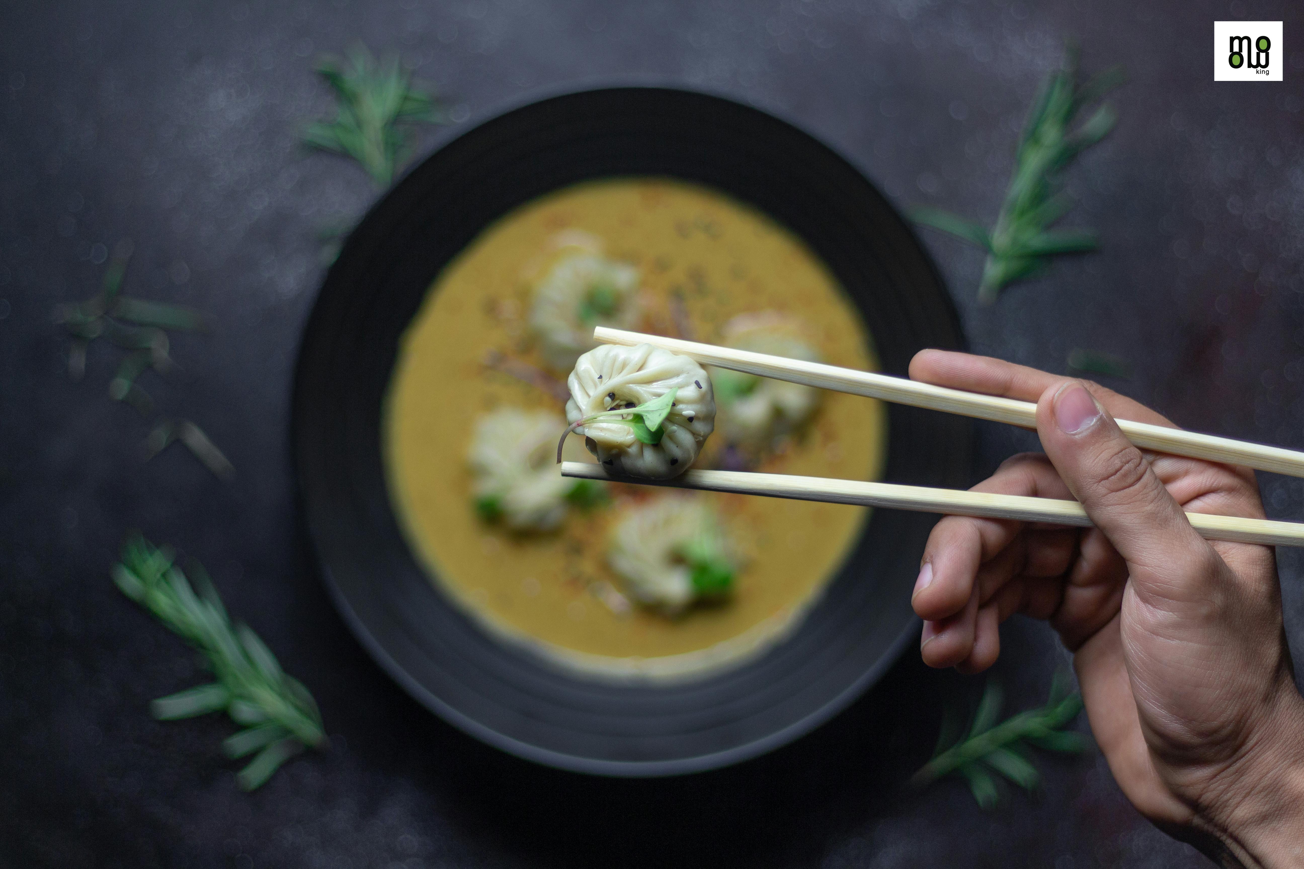 A person looking at their smartphone, checking for news and updates on the developing story.