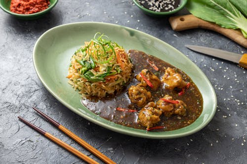 Free Rice Meal with Brown Sauce on Oval Plate Stock Photo