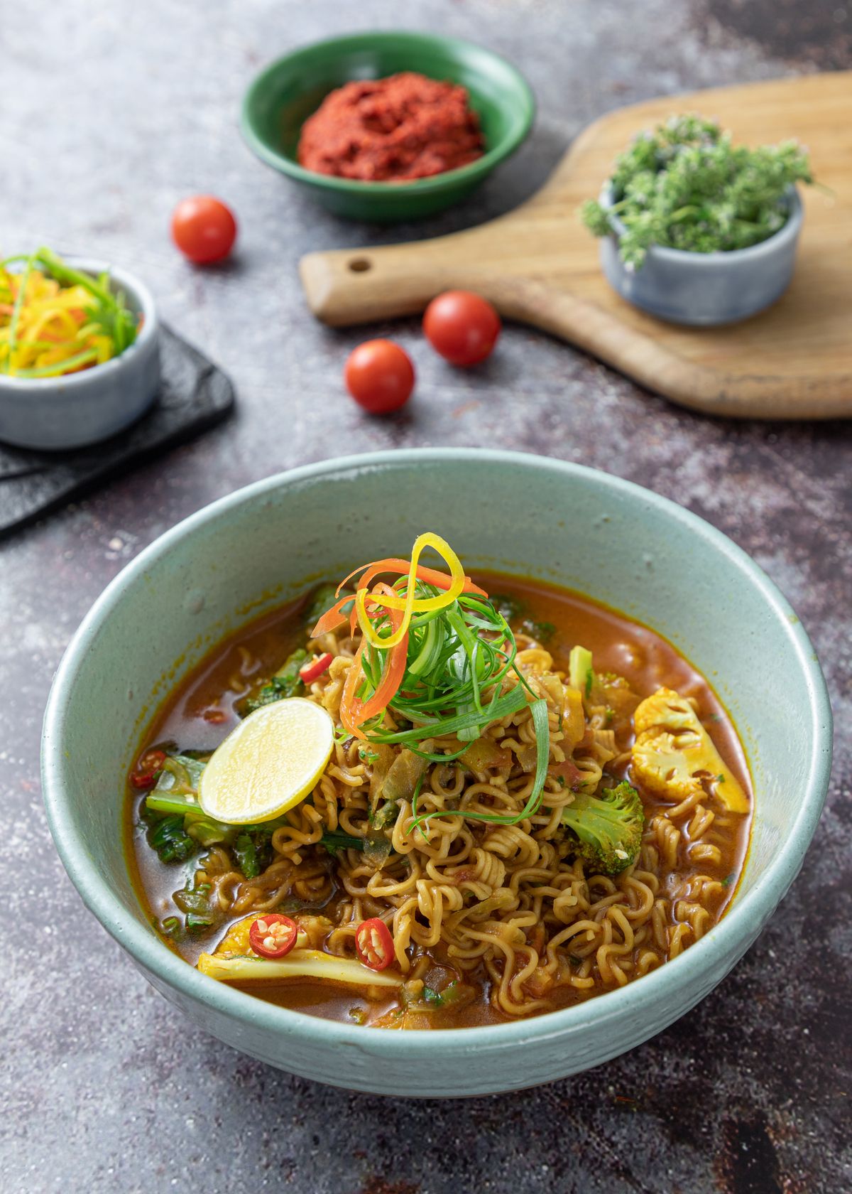 Japanese restaurant kitchen with chef preparing authentic Japanese noodle dishes