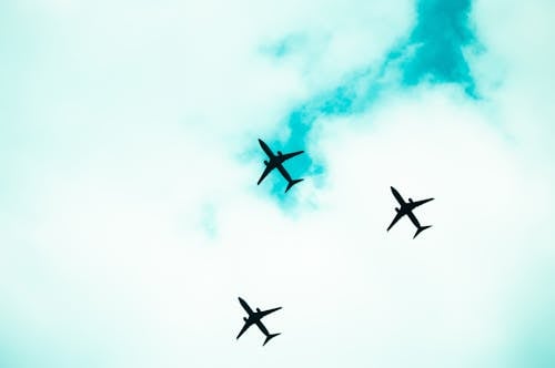 Free Airplanes in Mid Air Under White Clouds Stock Photo
