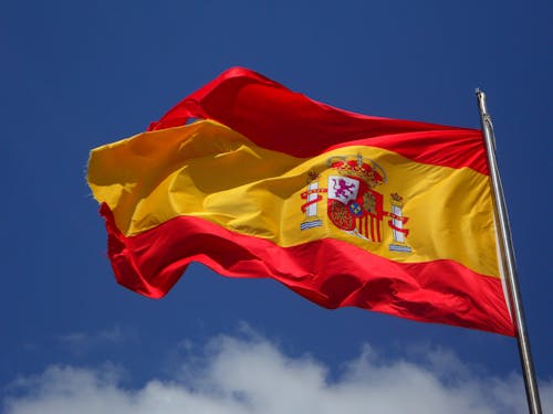 Free Spain Flag in Pole Stock Photo