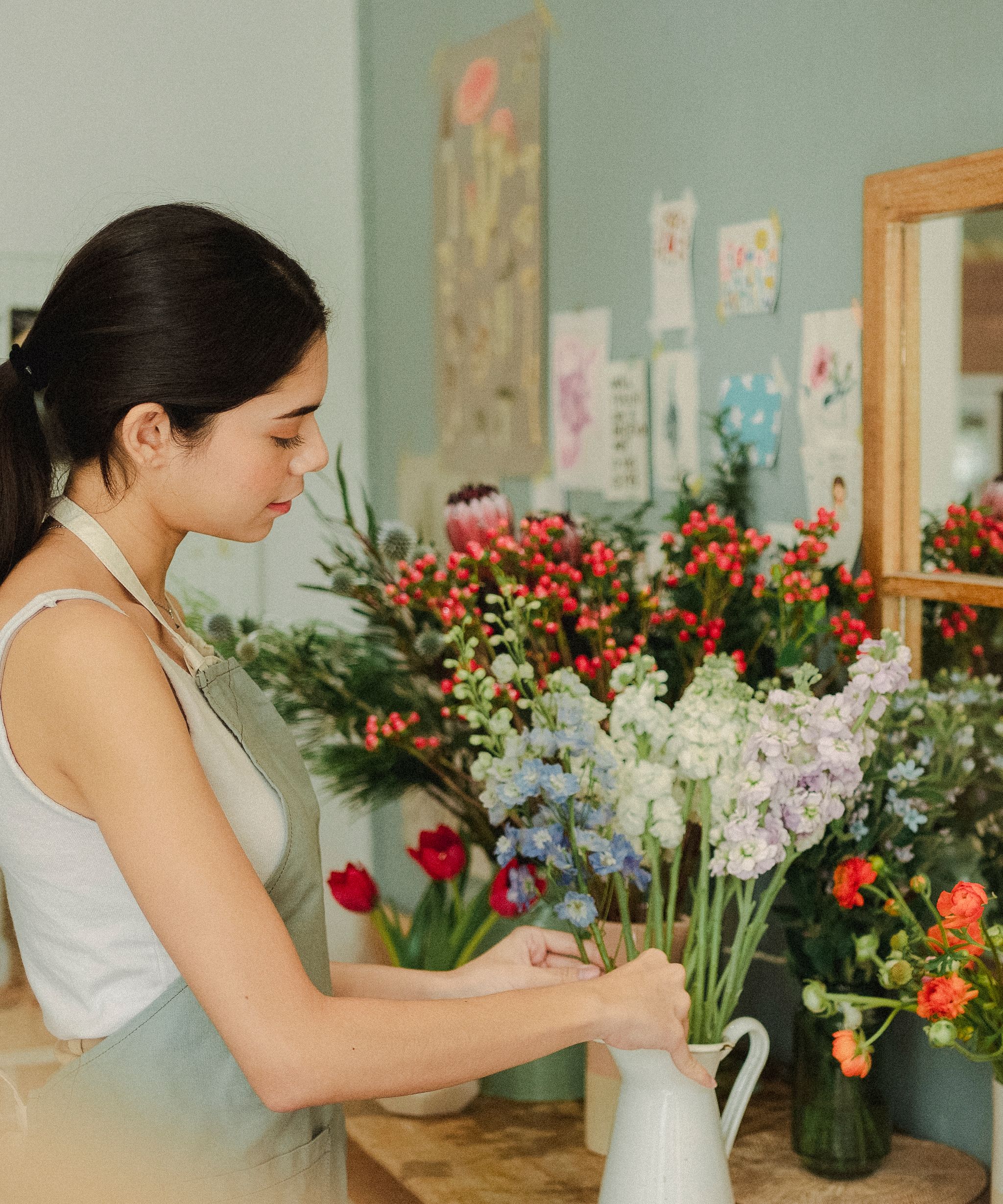 Florist arranging fresh flowers