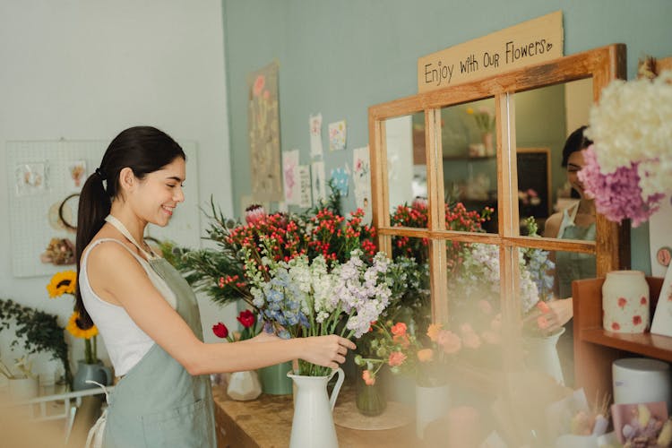 Happy Woman Working In Flower Shop