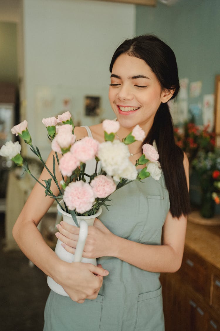 Happy Woman With Flowers In Floral Shop