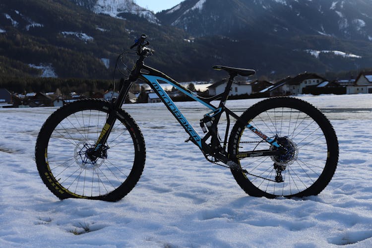 A Mountain Bike On A Snow Covered Ground