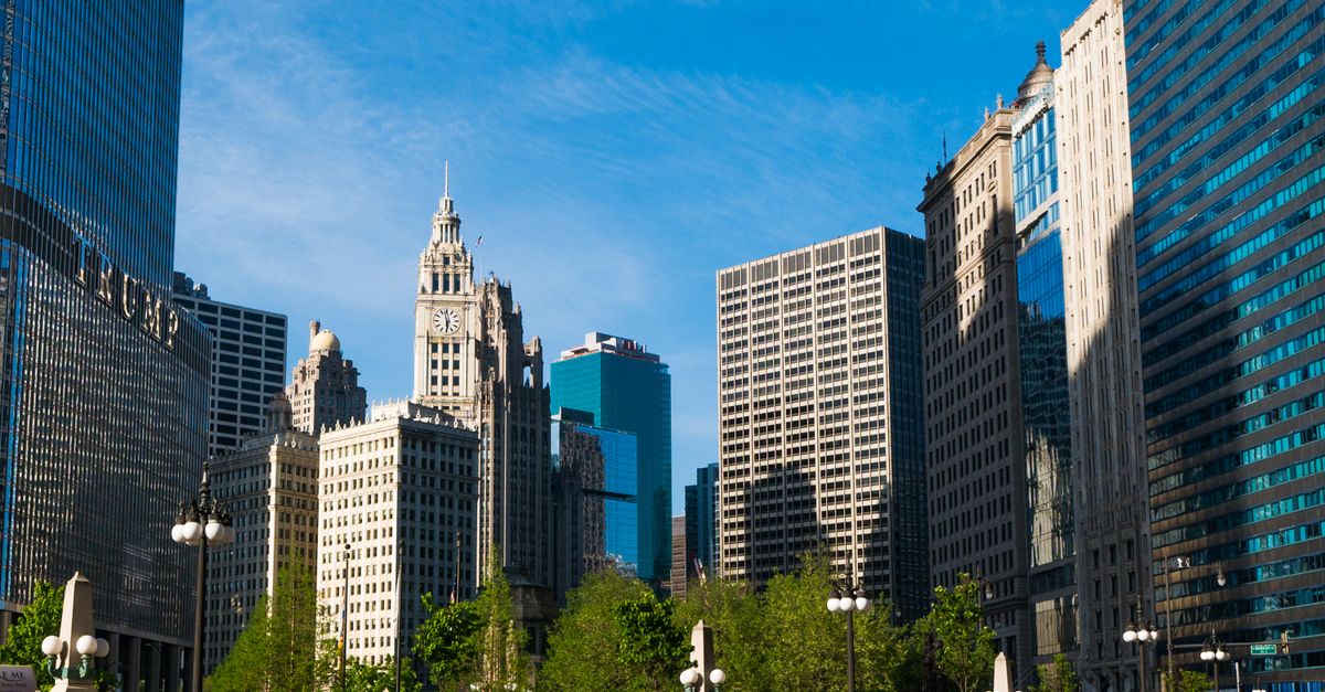 Capture of Chicago's modern skyscrapers and historic architecture under a vibrant blue sky.