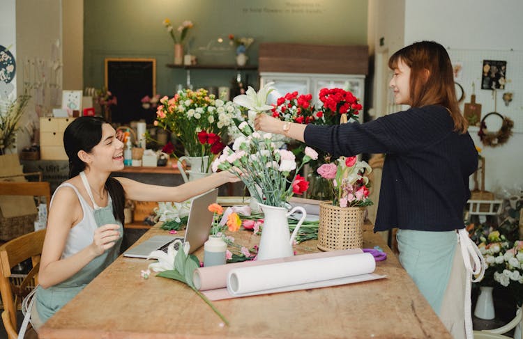 Multiracial Women Working In Floral Shop