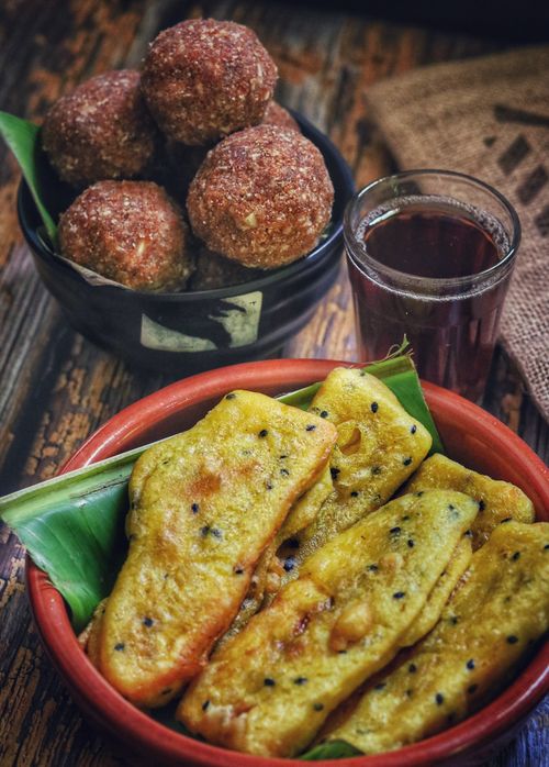 Free Close-up of Indian banana fritters and snacks in bowls, perfect for food photography. Stock Photo