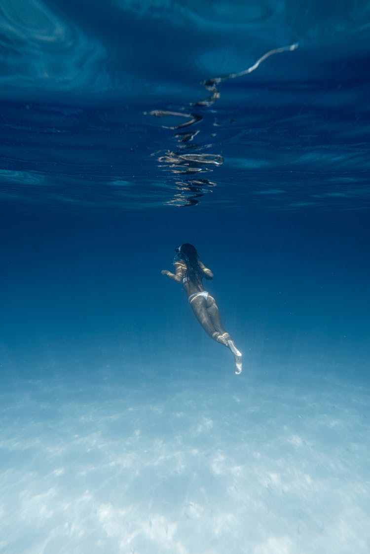 Anonymous Woman Diving In Blue Sea In Summer