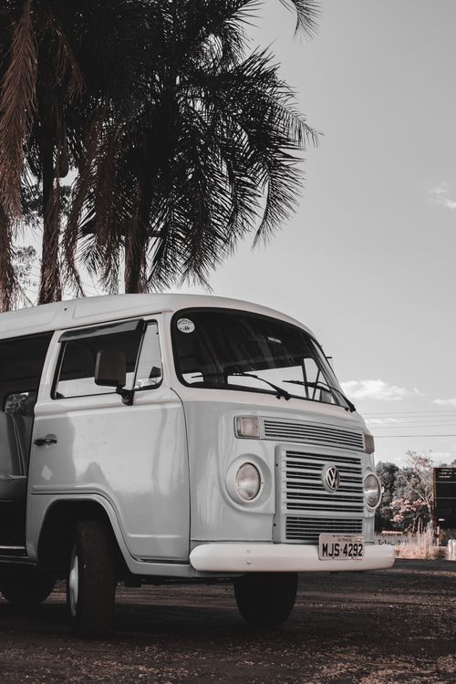 Free Classic Volkswagen van parked outdoors, showcasing its vintage appeal and timeless design. Stock Photo