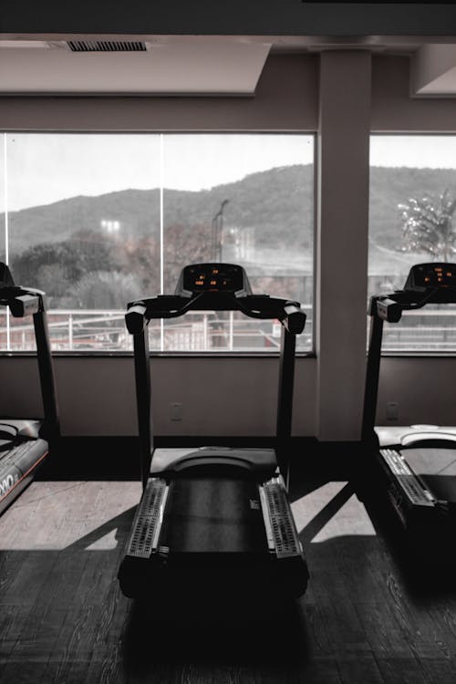 Free Treadmill Near Glass Window Stock Photo