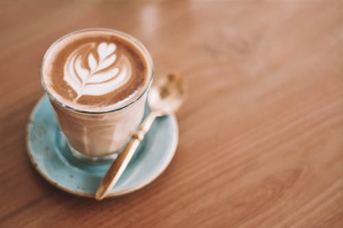 Free Coffee with Latte Art in Clear Glass Stock Photo