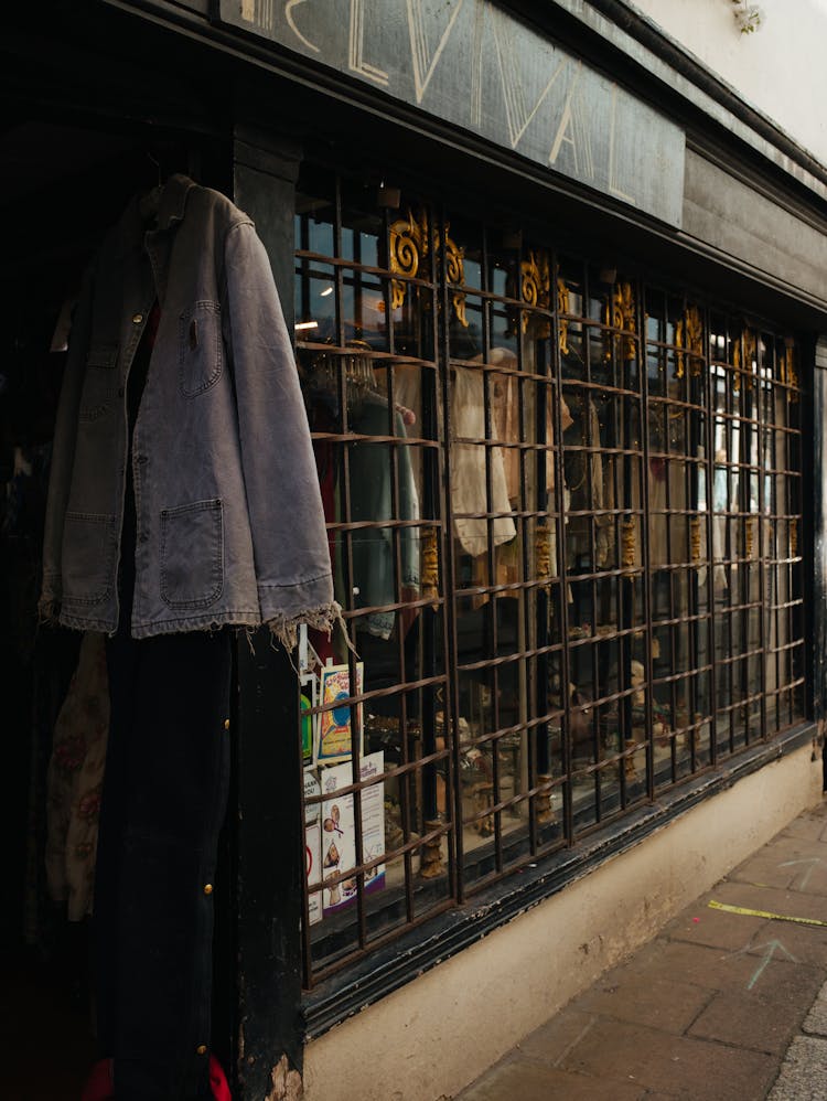 Bars In Window Of Clothing Store