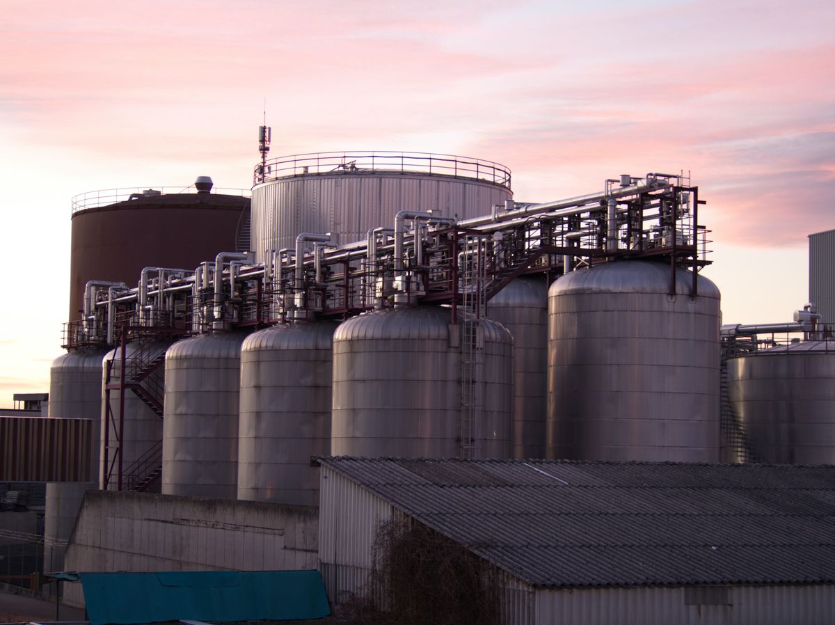 Stainless steel storage tanks and piping at an industrial facility