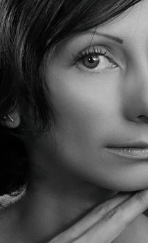 Close-up grayscale portrait of a woman's face captured in Kyiv.