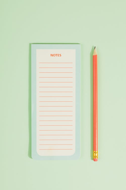 Free  Pencil Beside a Notepad Stock Photo