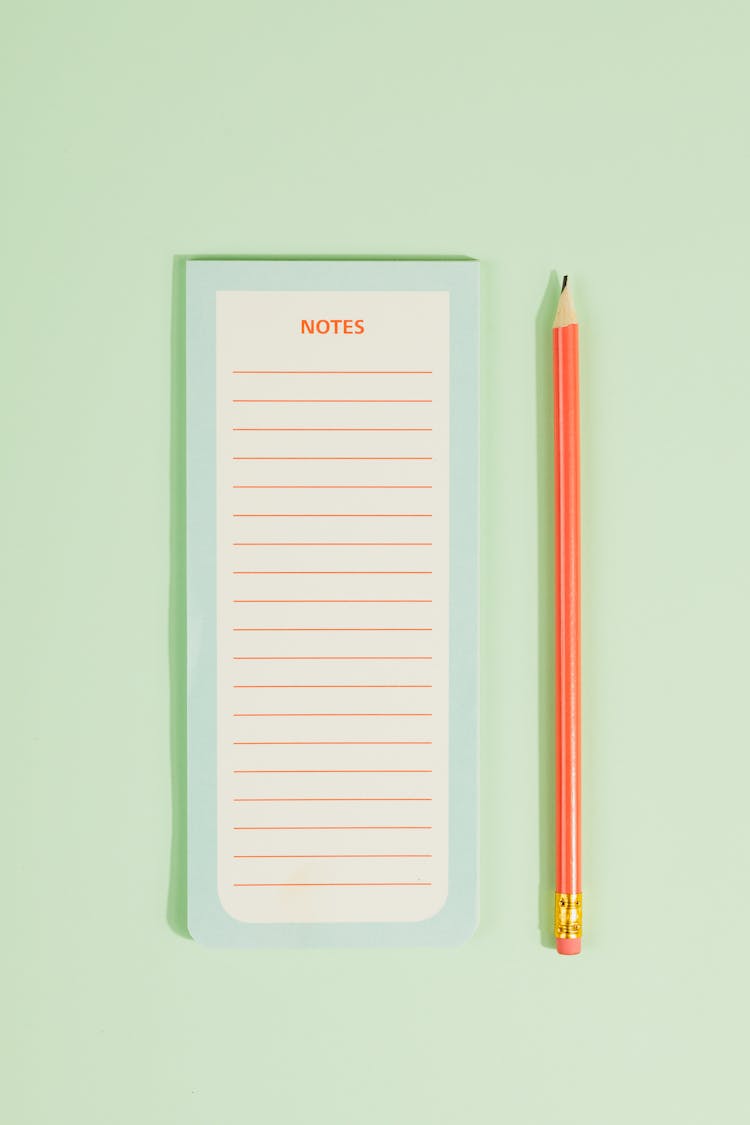  Pencil Beside A Notepad