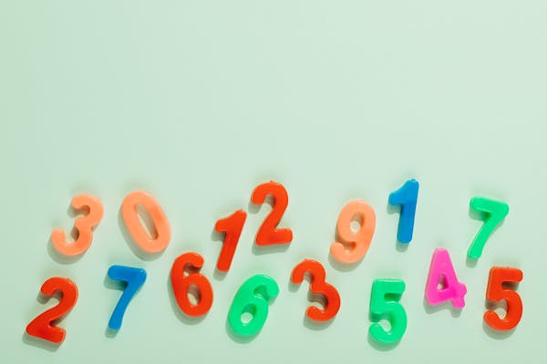 fridge magnet numbers scattered on table