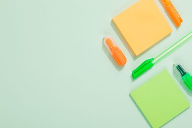 Sticky notes and markers on mint green, photo by Kaboompics.com on Pexels
