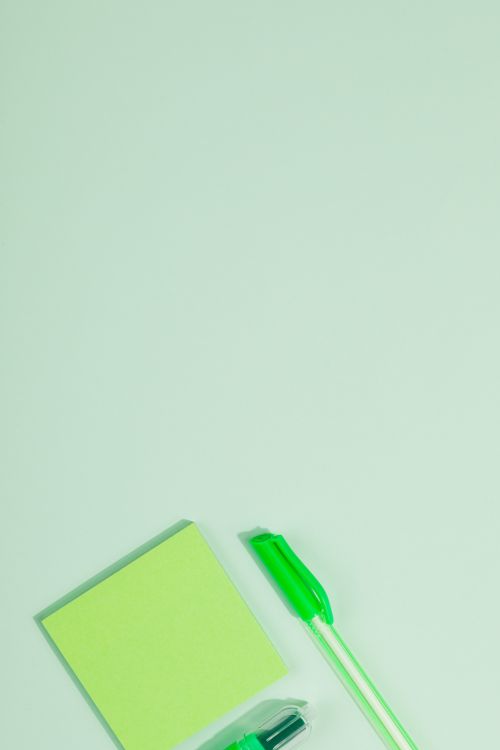 Free Top view of green office supplies on pastel green background, ideal for stationery themes. Stock Photo