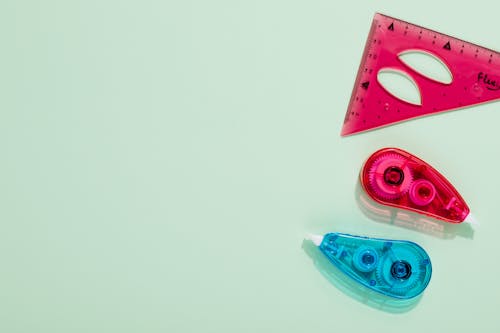 Free Correction Tapes Beside the Triangle Ruler Stock Photo