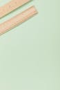 Brown Wooden Rulers on Light Green Surface