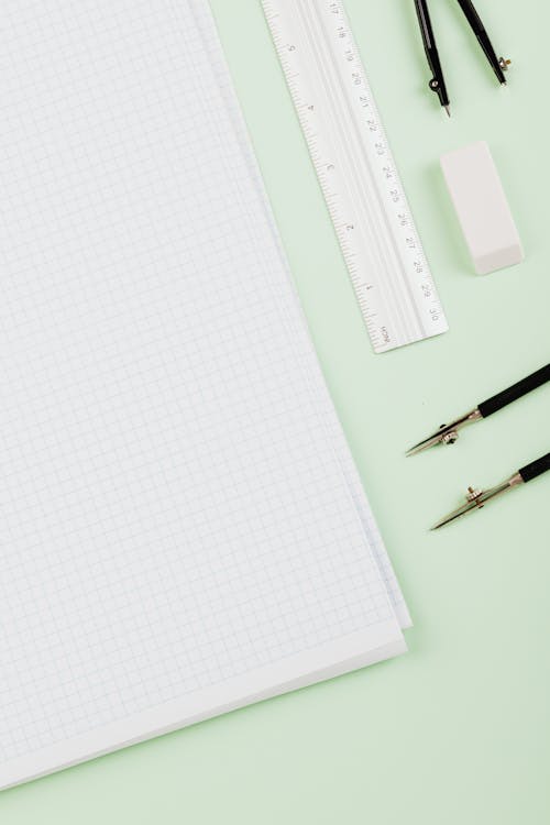 A Graph Paper Beside a Ruler and Compass