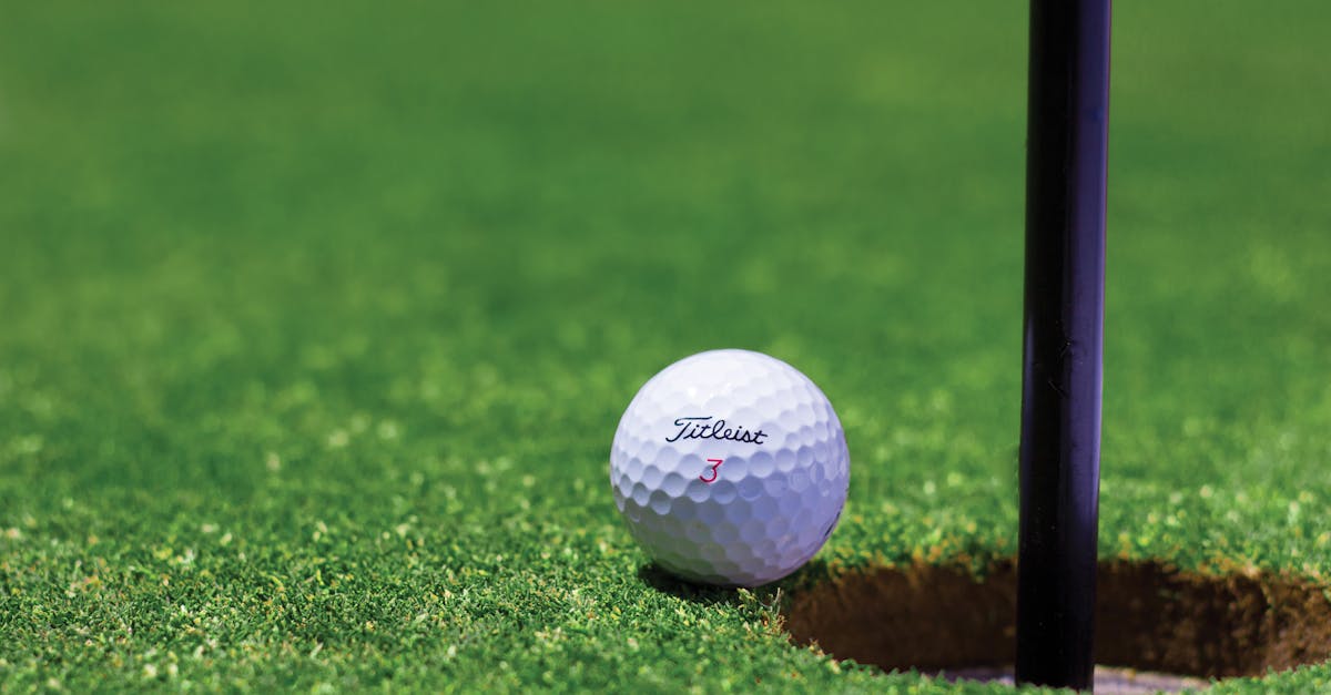 Titrist Golf Ball Near Golf Hole