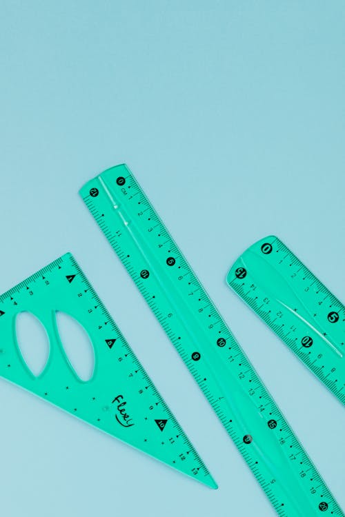 Free Green Ruler on White Surface Stock Photo
