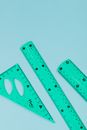 Green Ruler on White Surface