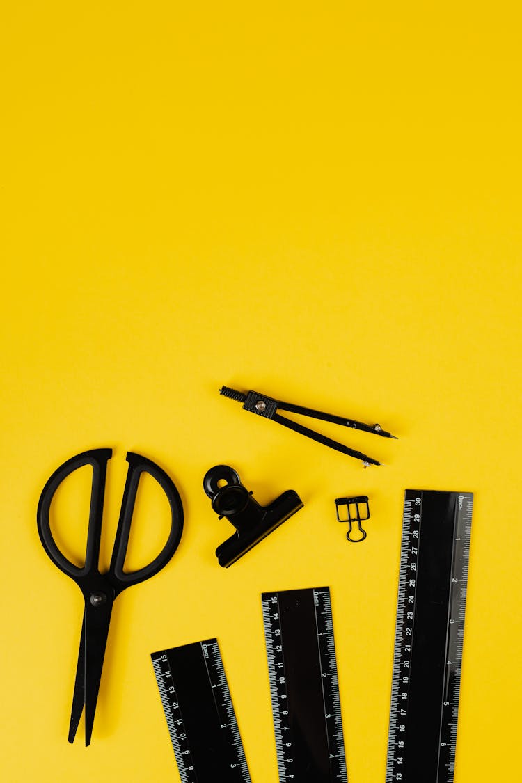 Office Supplies On Yellow Background