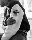A Man Wearing a Sporting Event Jacket