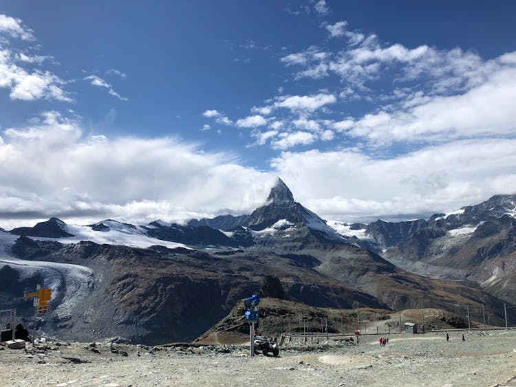 View Of The Matterhorn Mountain Peak Under Blue Cloudy Sky