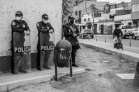 Policemen Standing on Sidewalk Wearing Face Masks