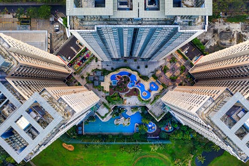 Bird's Eye View of High Rise Buildings with Swimming Pools 