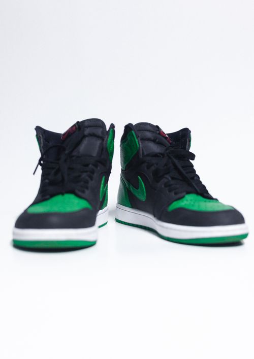 Free Black and green high-top sneakers with a white background, product photography. Stock Photo