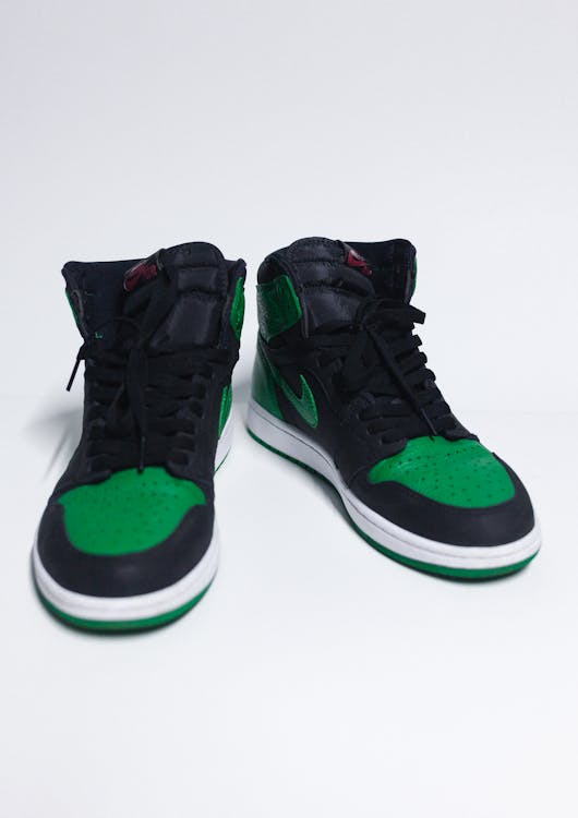 A Black and Green High Cut Nike Jordan