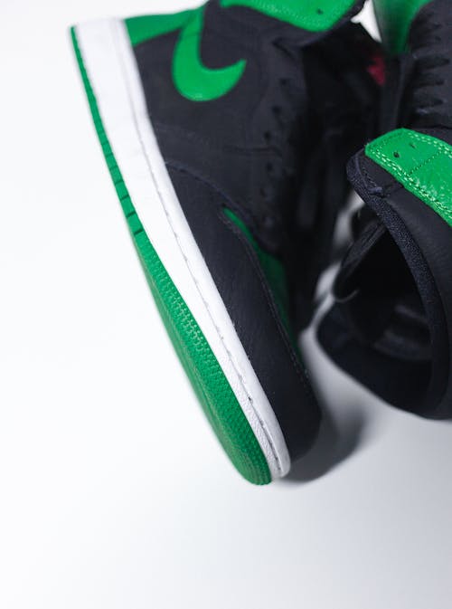 Clos-up Shot of a Black and Green Nike Sneaker 