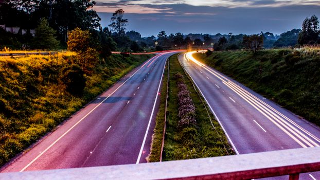 Dynamic long exposure shot of a highway in Gillitts, South Africa during twilight.