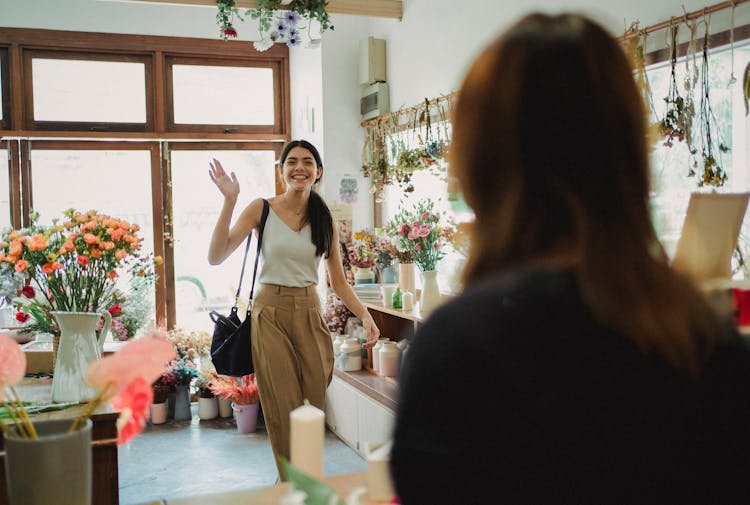 Happy Woman Waving To Florist