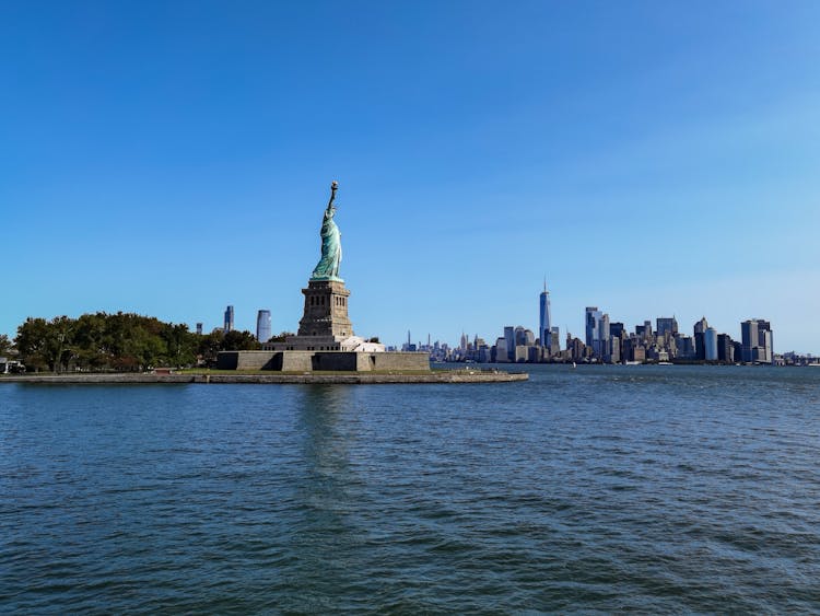 View Of The Statue Of Liberty And The New York City Skyline