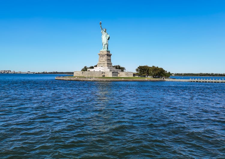 The Statue Of Liberty In Liberty Island At The New York Harbor