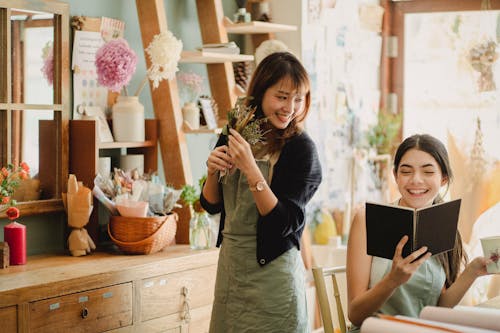 Happy friends spending time in cozy room