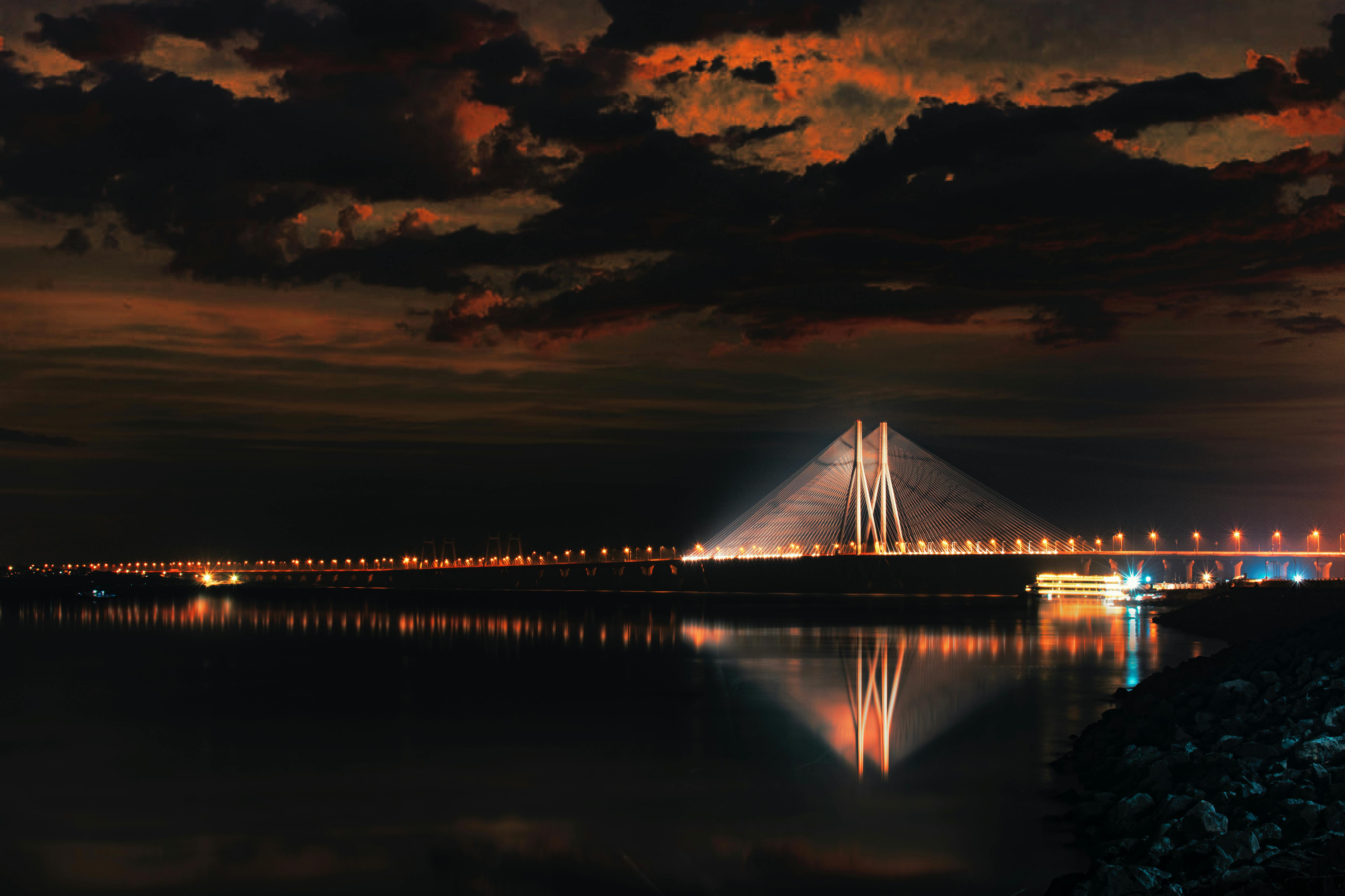 body of water near bridge during night time